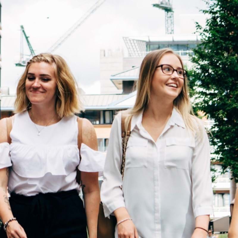 Image of two people walking outside