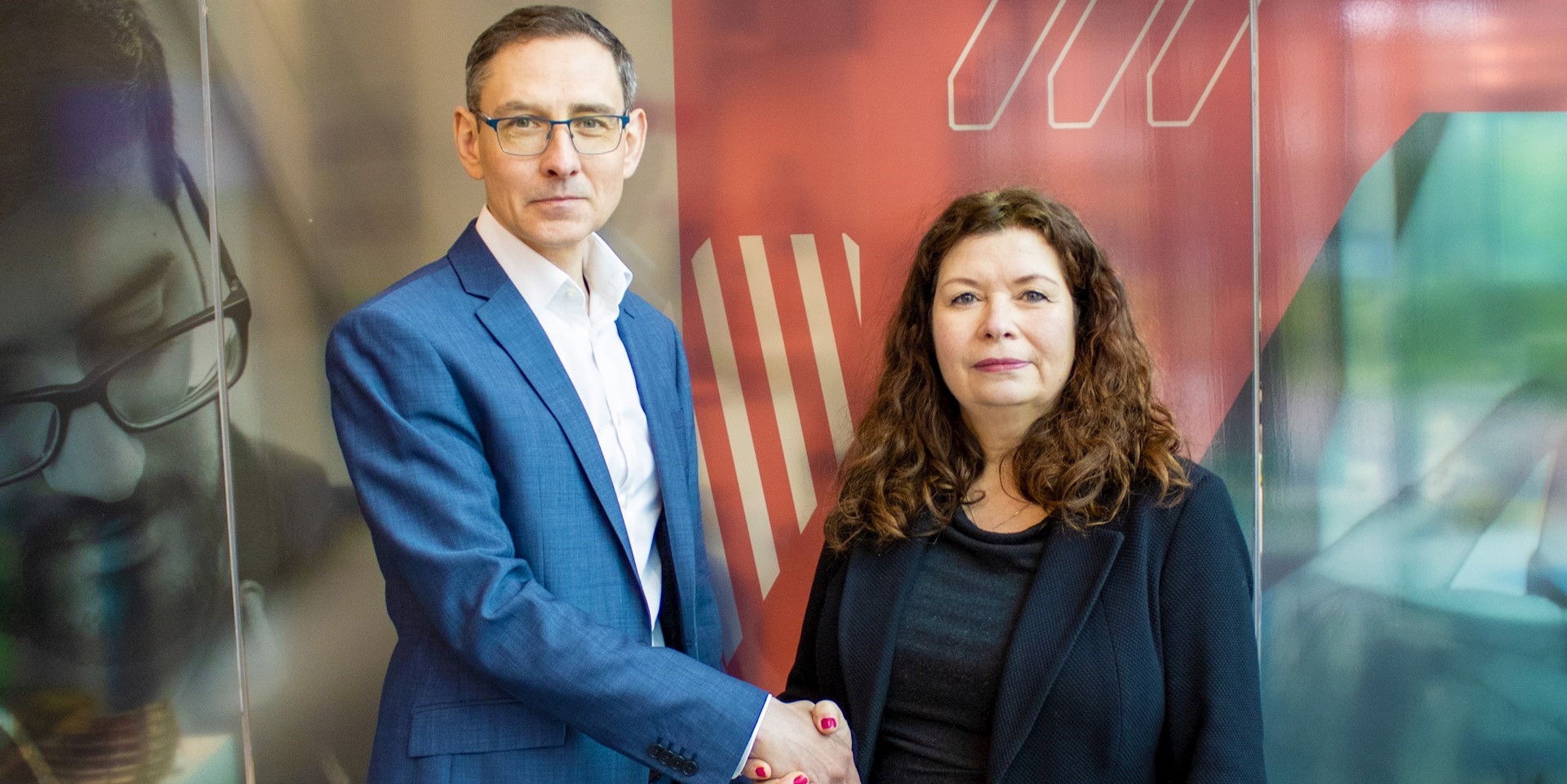 Richard Jeffery, Founder Partner Of Growth Flag, And Dr Francine Morris, Associate Dean For Enterprise And Engagement, Salford Business School shaking hands