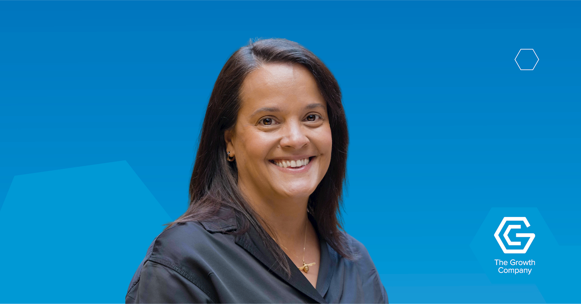 Victoria Braddock headshot on blue background with the Growth Company logo